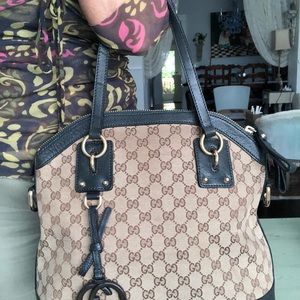 Authentic Gucci hand bag with gold hardware.